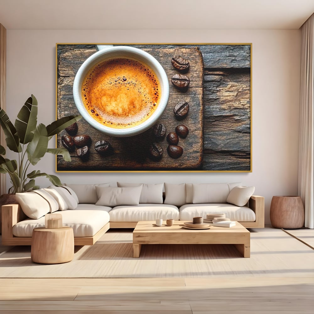 Tablou canvas cu ceasca de espresso si boabe de cafea, in rama de aluminiu auriu, pe perete intr-un living